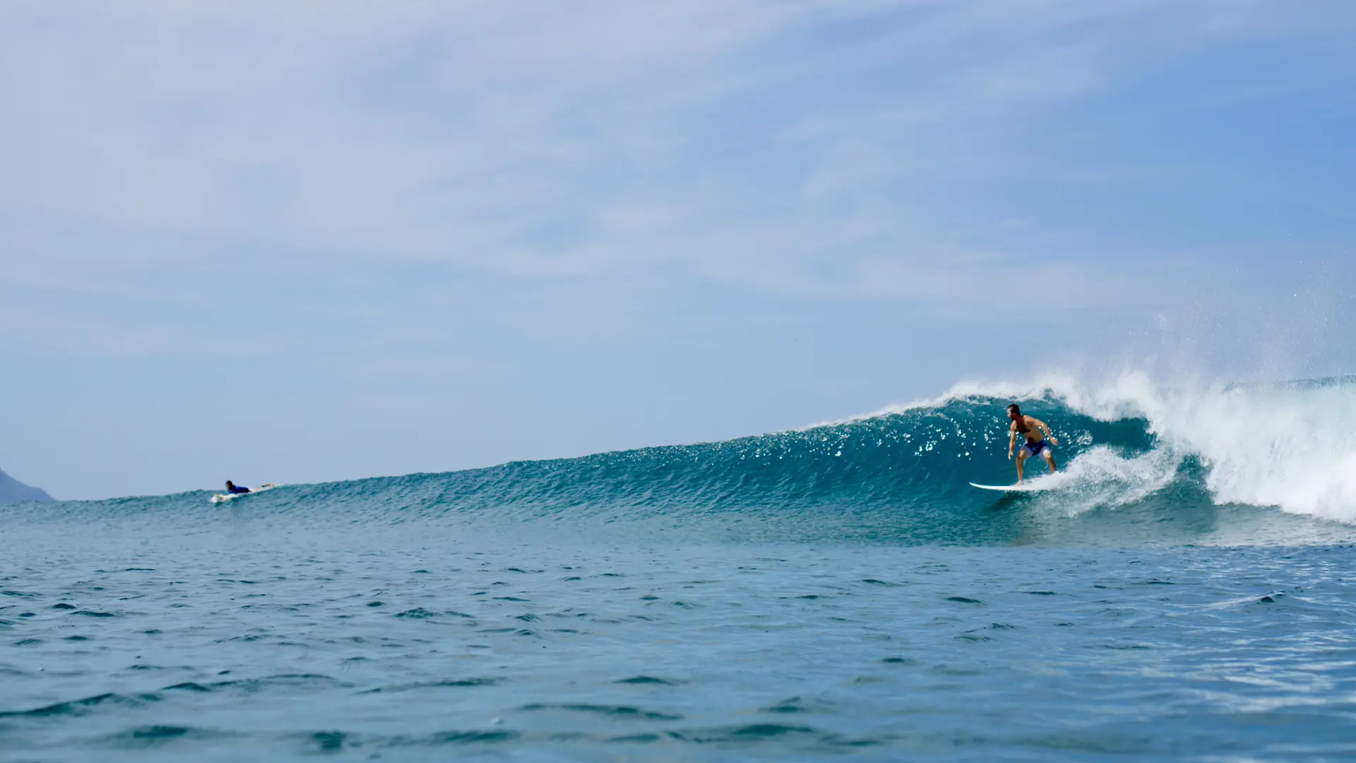 Clean wave breaking at a Nosara beach break